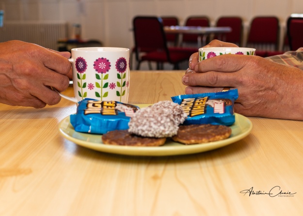 a confidential meeting over a coffee and biscuits