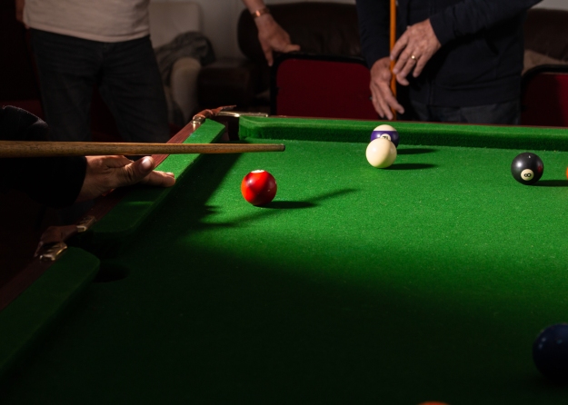 a game of pool - table corner with side lighting